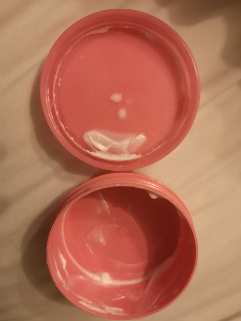 An empty tub of moisturiser.